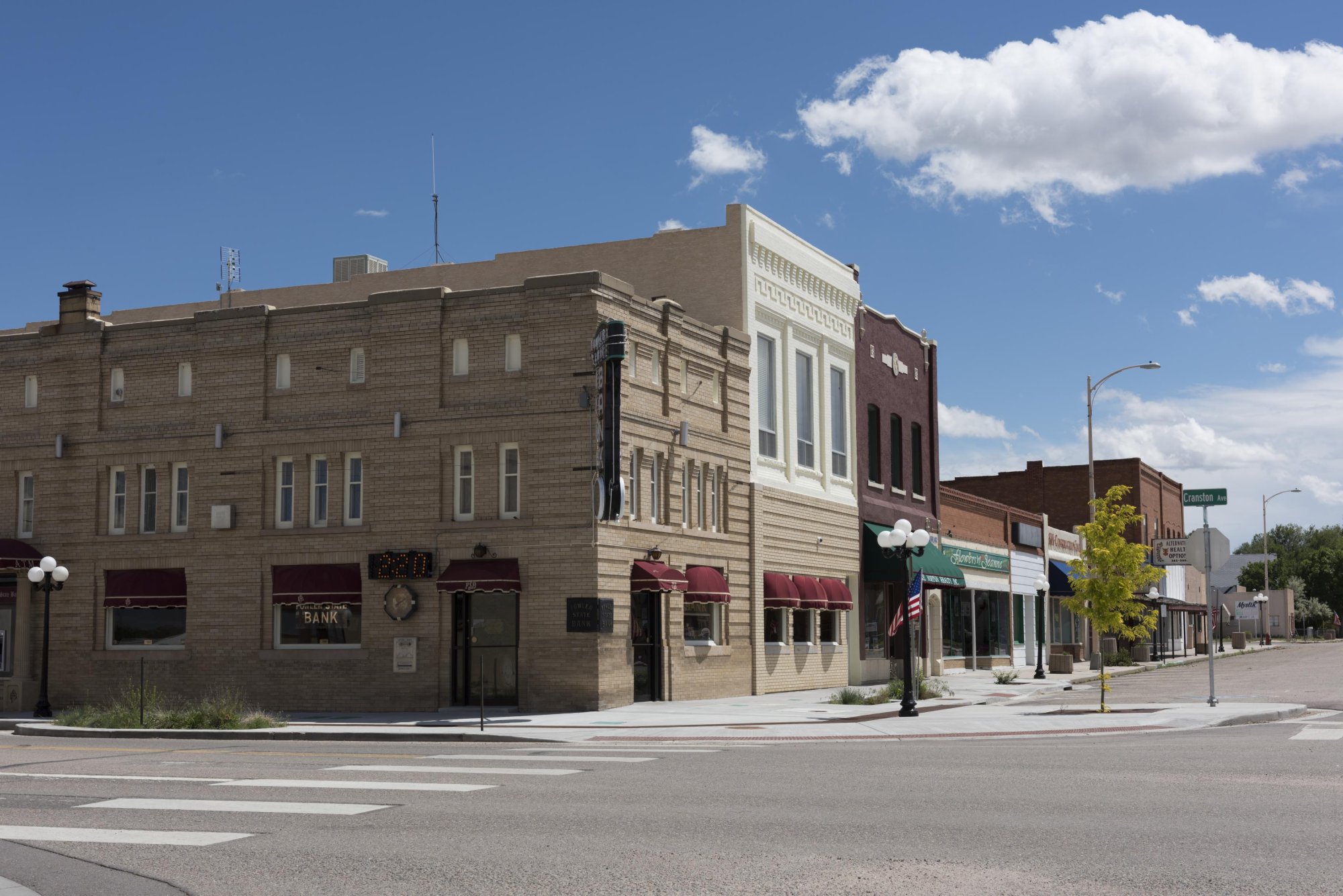 Main Street, Fowler, Colorado. Saturday afternoon on the square. Most things worth knowing were settled here.